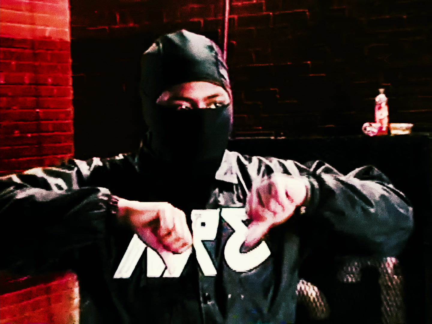 Red-lit masked portrait film still from Hooligan by Tovii